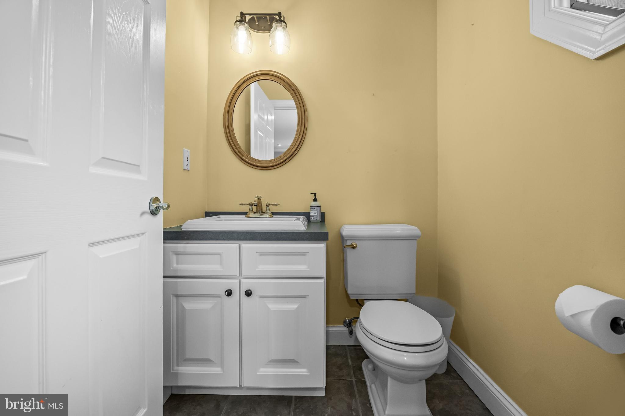 31 Wesley Avenue Cherry Hill, NJ 08002 - Photo 20 of 52 a bathroom with a toilet sink vanity and mirror