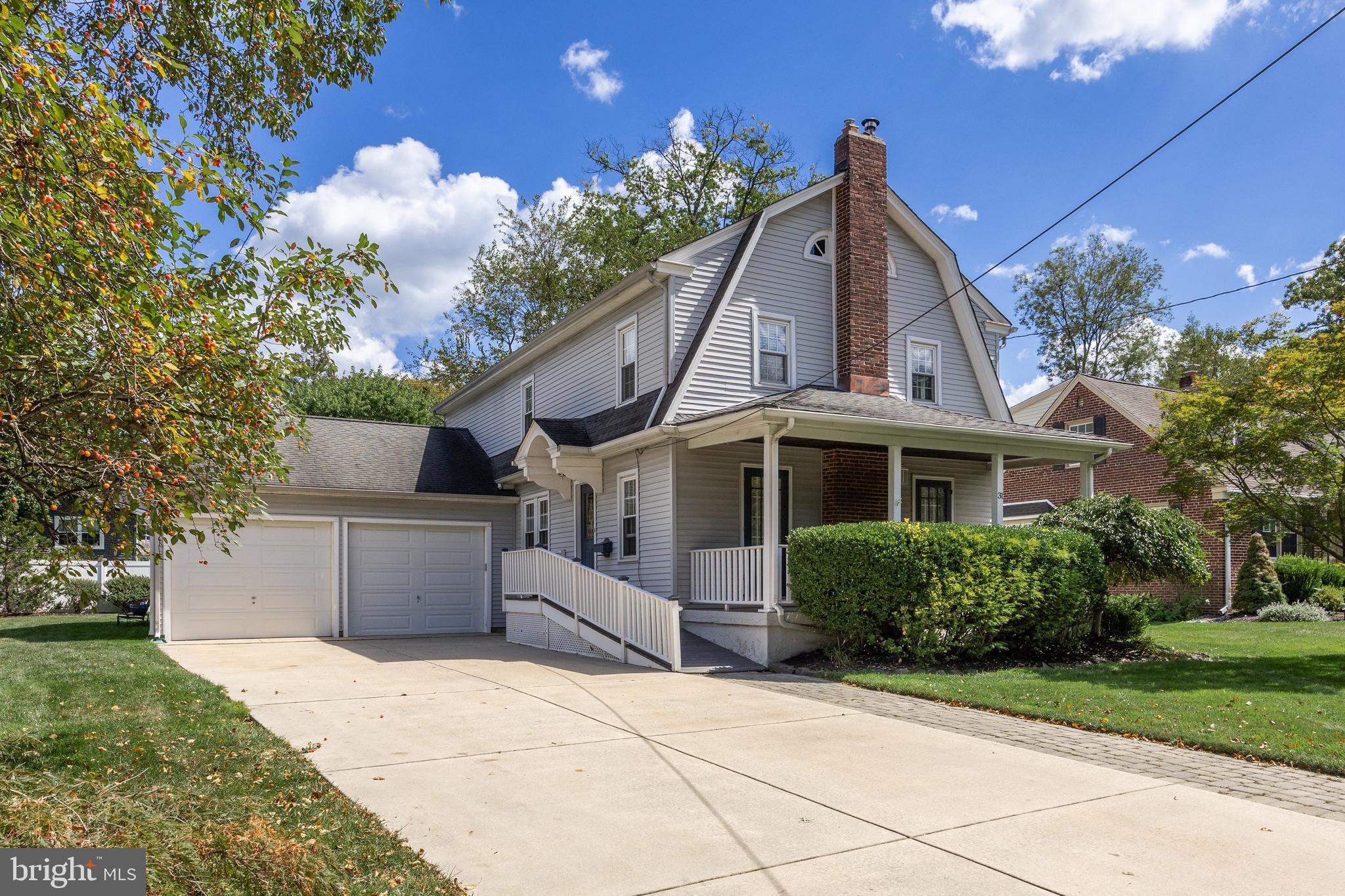 31 Wesley Avenue Cherry Hill, NJ 08002 - Photo 2 of 52 a front view of a house with a yard