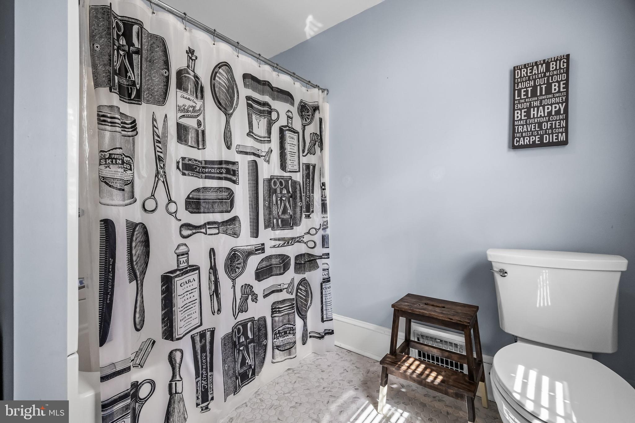 31 Wesley Avenue Cherry Hill, NJ 08002 - Photo 30 of 52 a bathroom with a toilet and a shower curtain