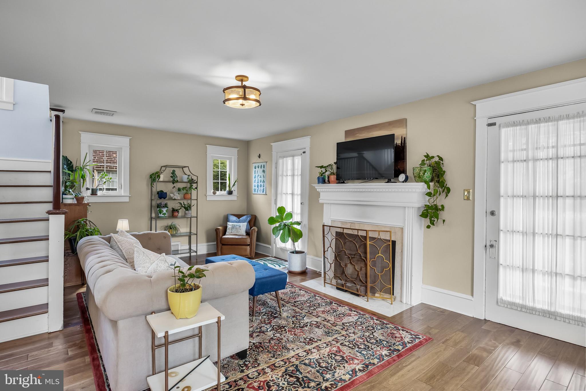 31 Wesley Avenue Cherry Hill, NJ 08002 - Photo 5 of 52 a living room with furniture a flat screen tv and a fireplace