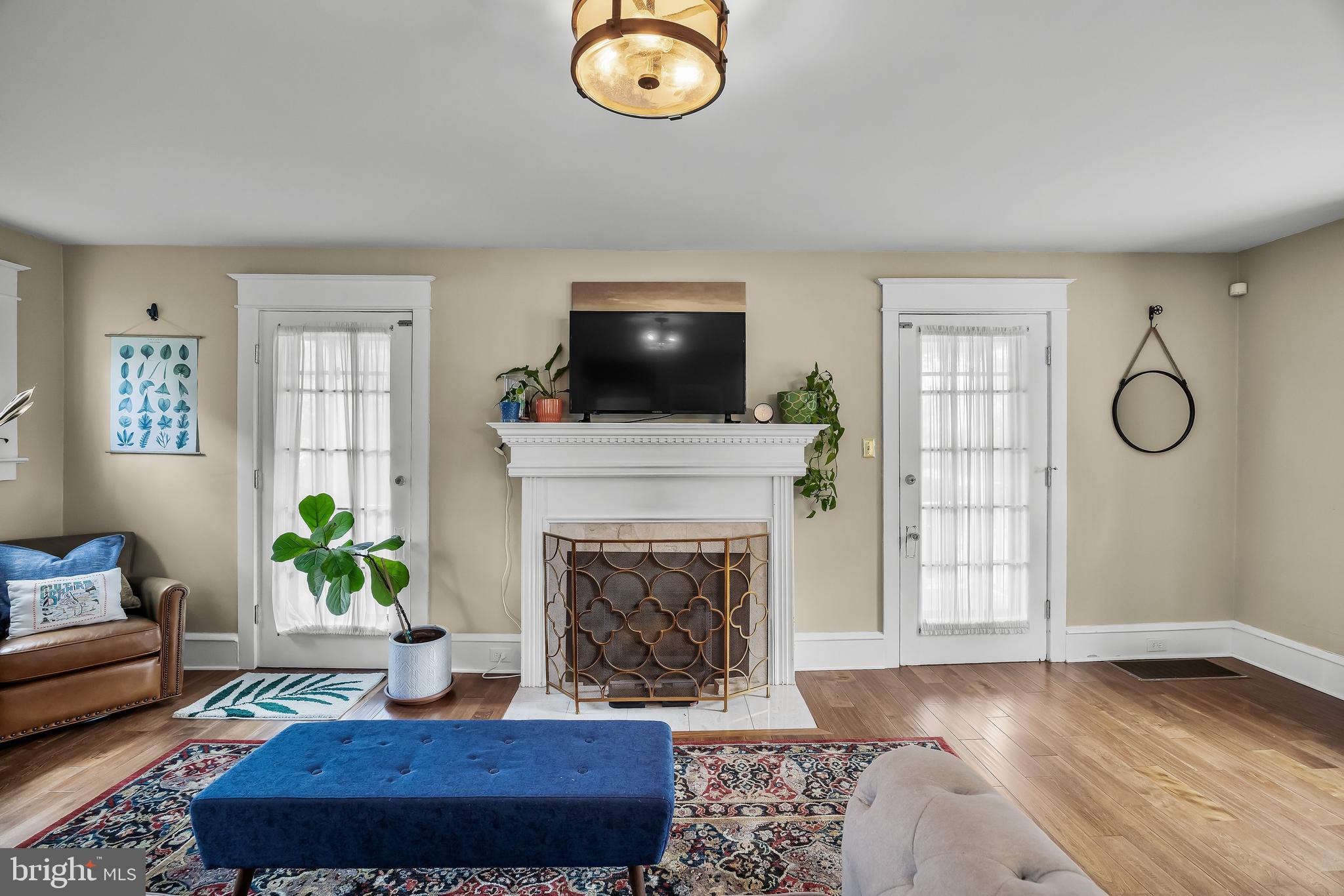 31 Wesley Avenue Cherry Hill, NJ 08002 - Photo 6 of 52 a living room with furniture a fireplace and a flat screen tv