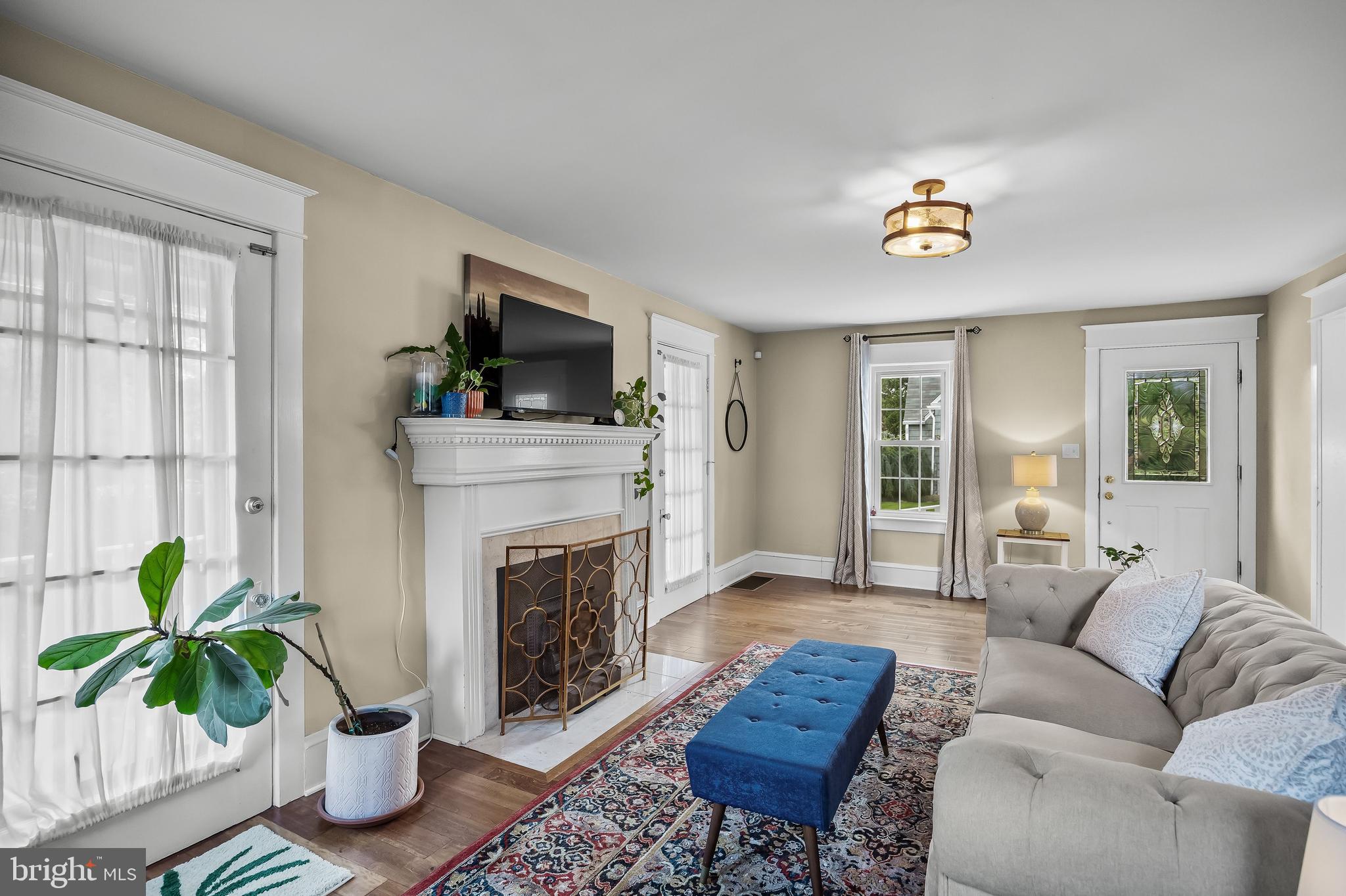 31 Wesley Avenue Cherry Hill, NJ 08002 - Photo 7 of 52 a living room with furniture a fireplace and a flat screen tv