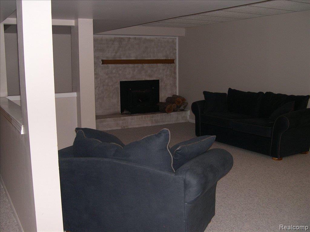 320 East Gunn Road Rochester, MI 48306 - Photo 13 of 16 Finished Lower Level with Firepl