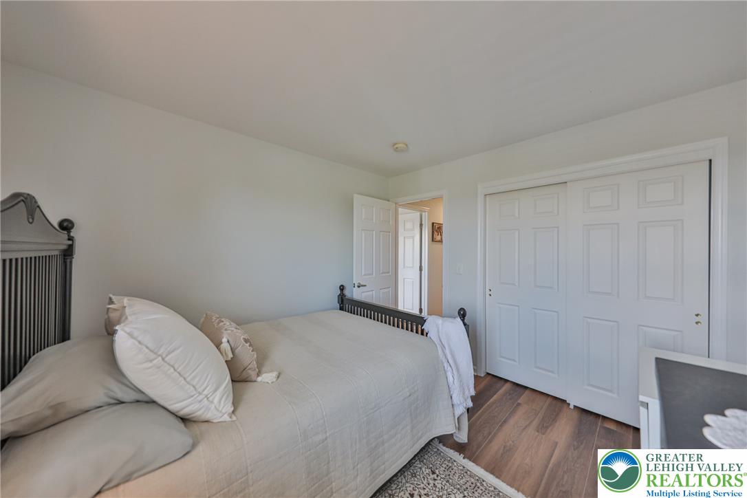 163 Muirfield Way Easton, PA 18042 - Photo 30 of 48 a bedroom with a bed and wooden floor