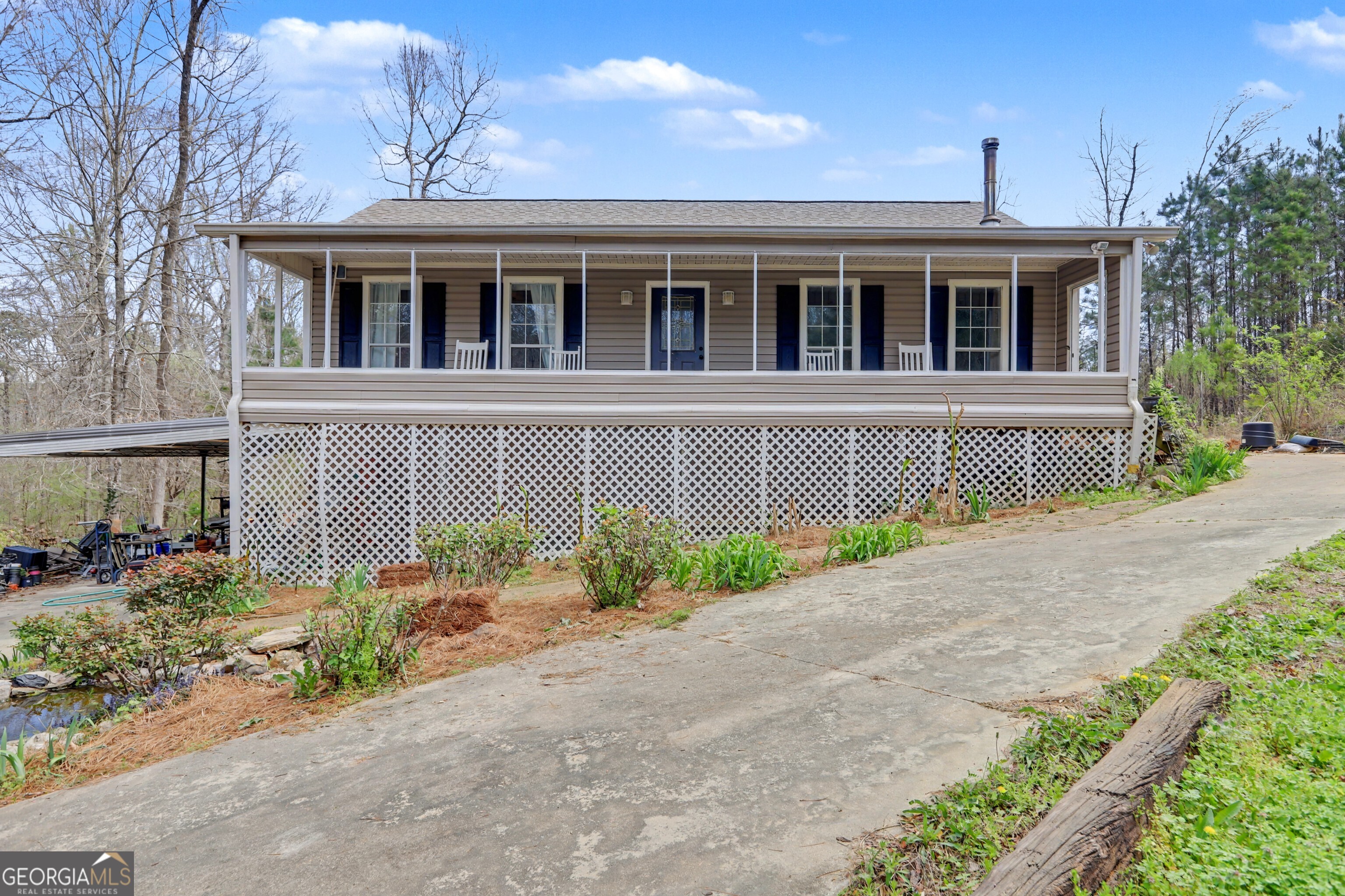 376 Doe Lane Mansfield, GA 30055 - Photo 1 of 28 a front view of a house with garden
