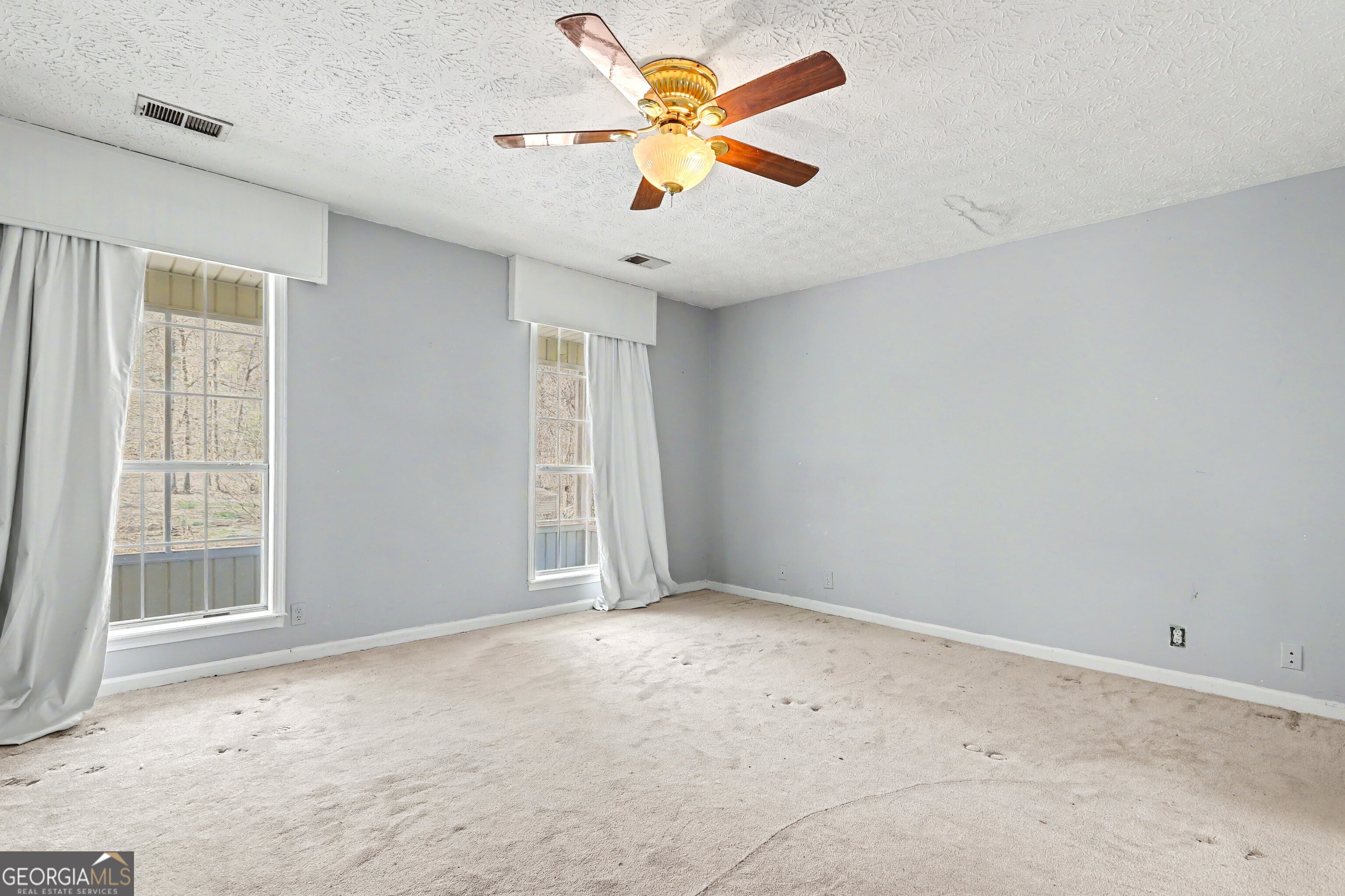 376 Doe Lane Mansfield, GA 30055 - Photo 15 of 28 a view of an empty room with a window
