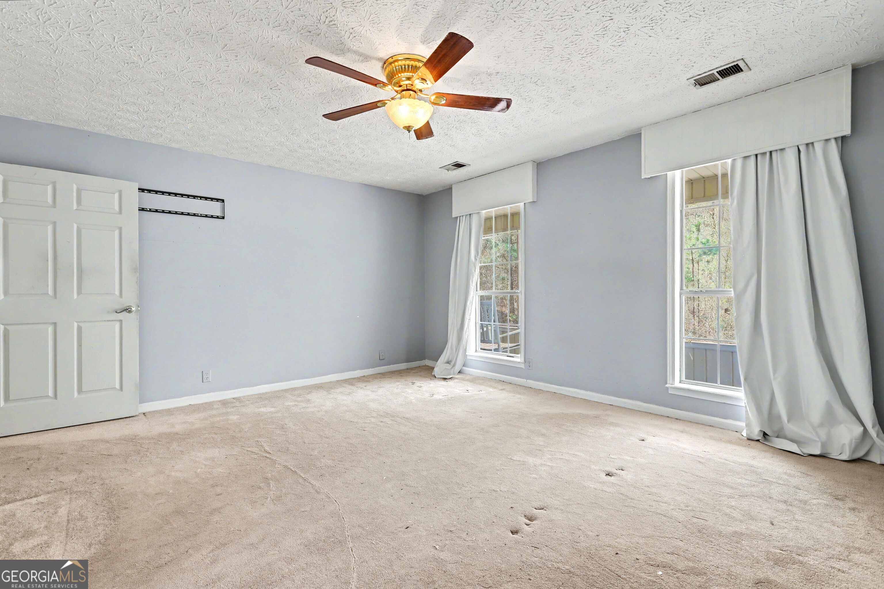 376 Doe Lane Mansfield, GA 30055 - Photo 18 of 28 wooden floor in an empty room with a window