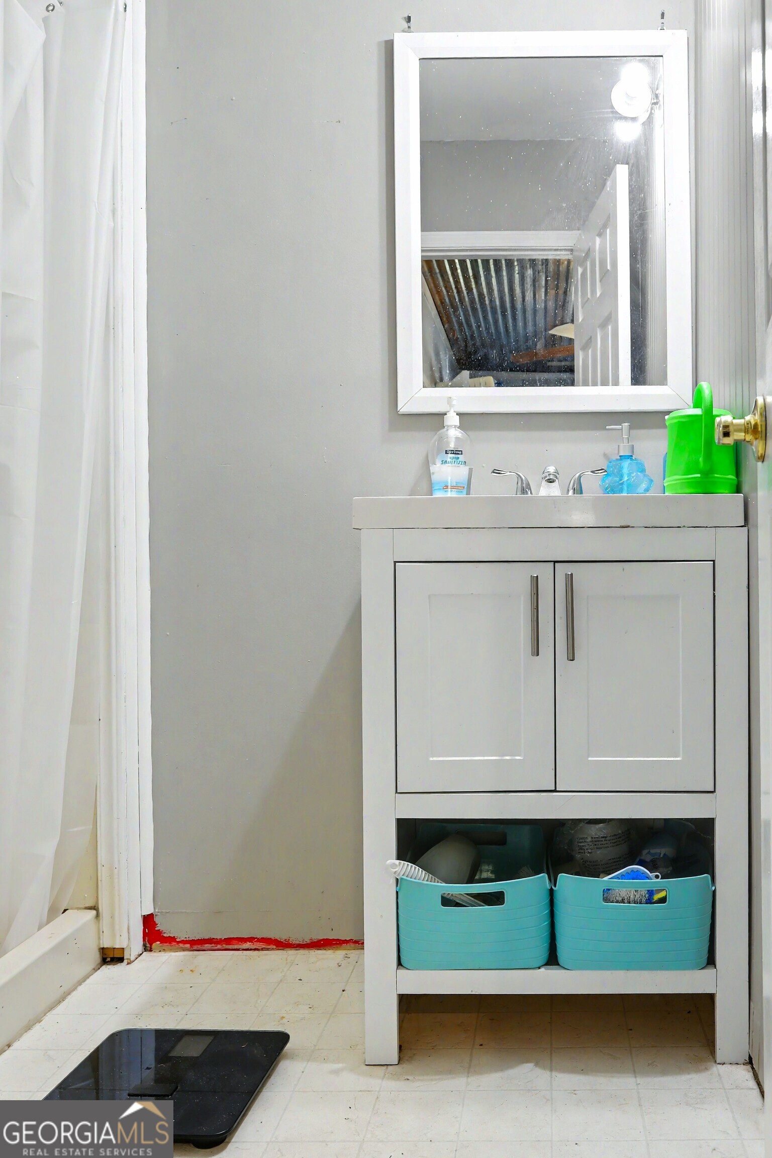 376 Doe Lane Mansfield, GA 30055 - Photo 25 of 28 a bathroom with a sink and a mirror