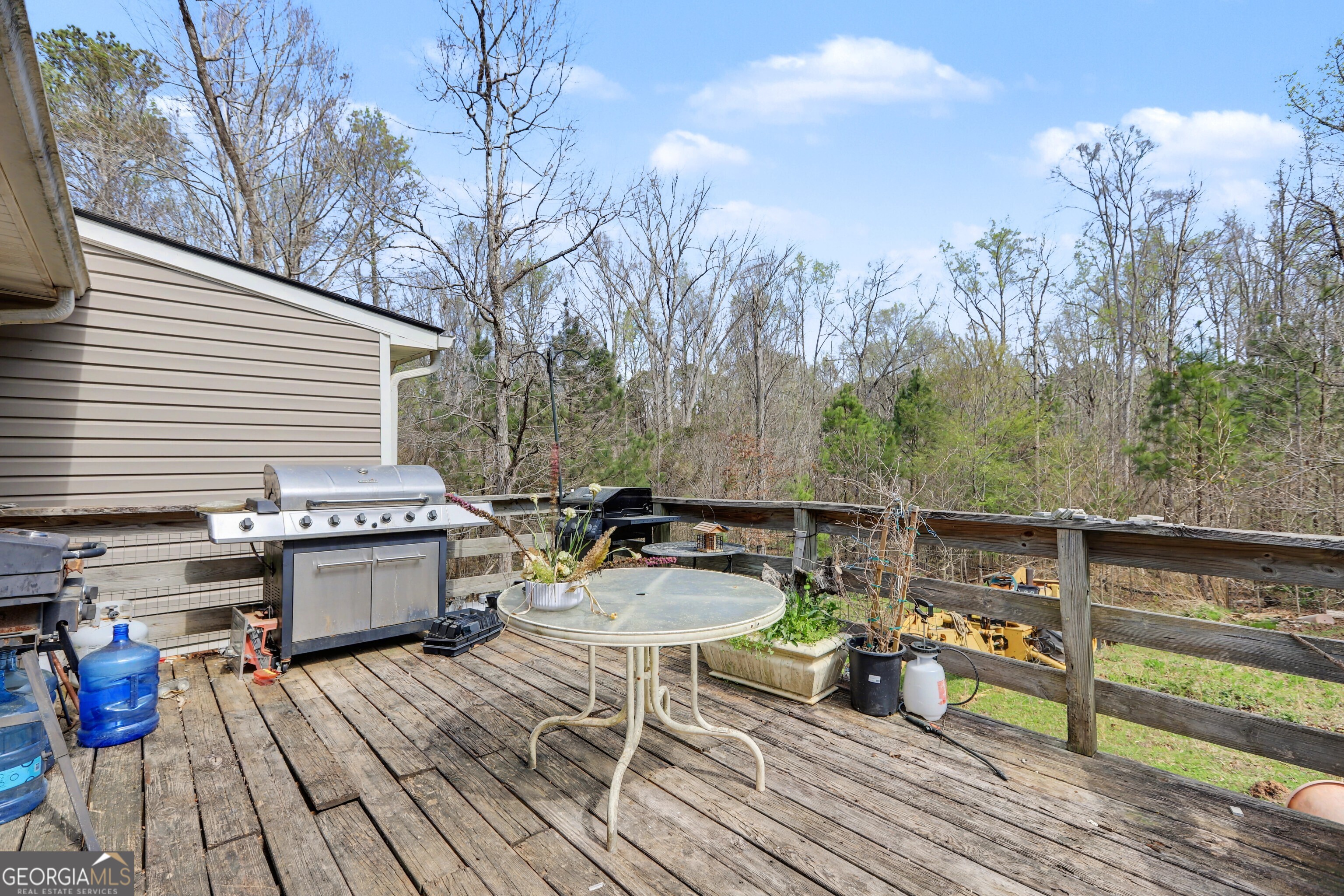 376 Doe Lane Mansfield, GA 30055 - Photo 3 of 28 a view of a balcony with wooden floor and outdoor seating