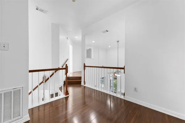 a view of an entryway with wooden floor