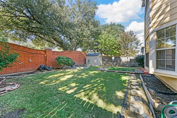 a backyard of a house with lots of green space