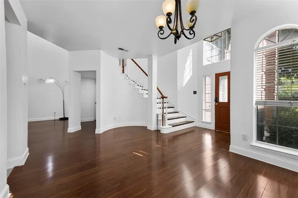a view of entryway with stairs and wooden floor