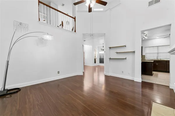 a view of a kitchen with a sink and a refrigerator
