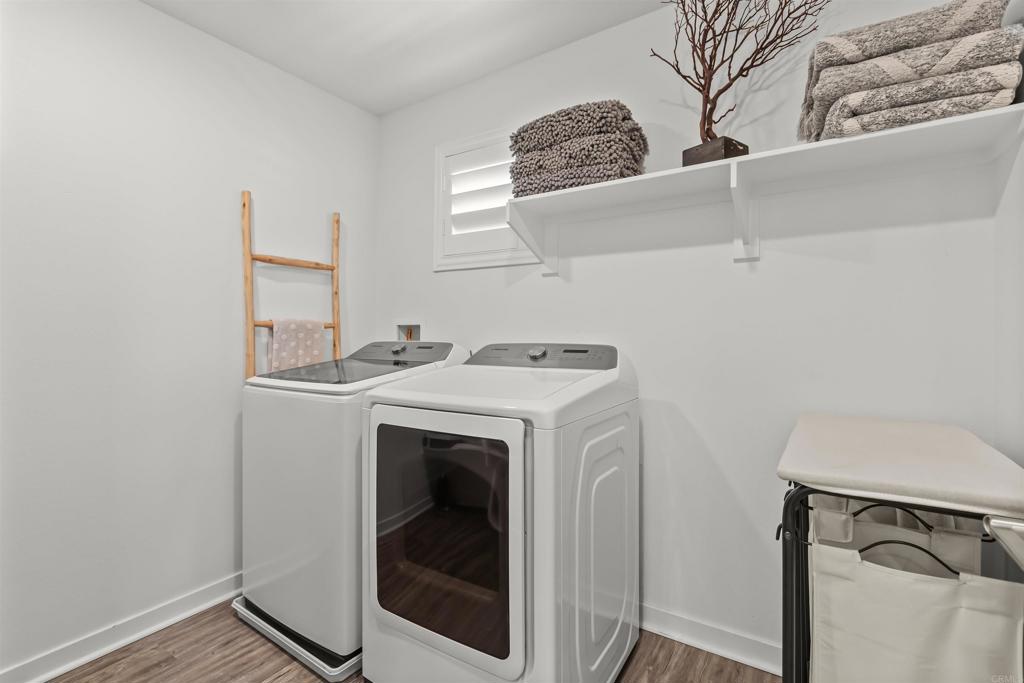 29809 Gypsy Vanner Way Menifee, CA 92584 - Photo 24 of 45 a utility room with dryer and washer