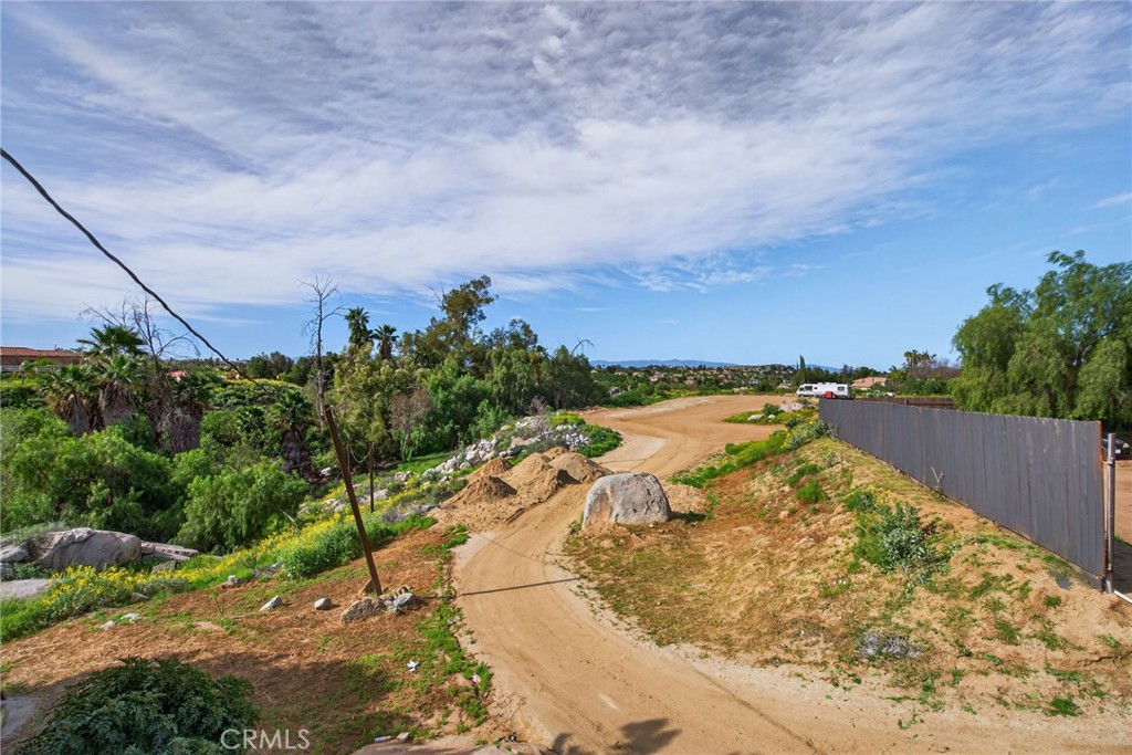 14435 Wood Road Riverside, CA 92508 - Photo 43 of 66 a view of a lake with a yard