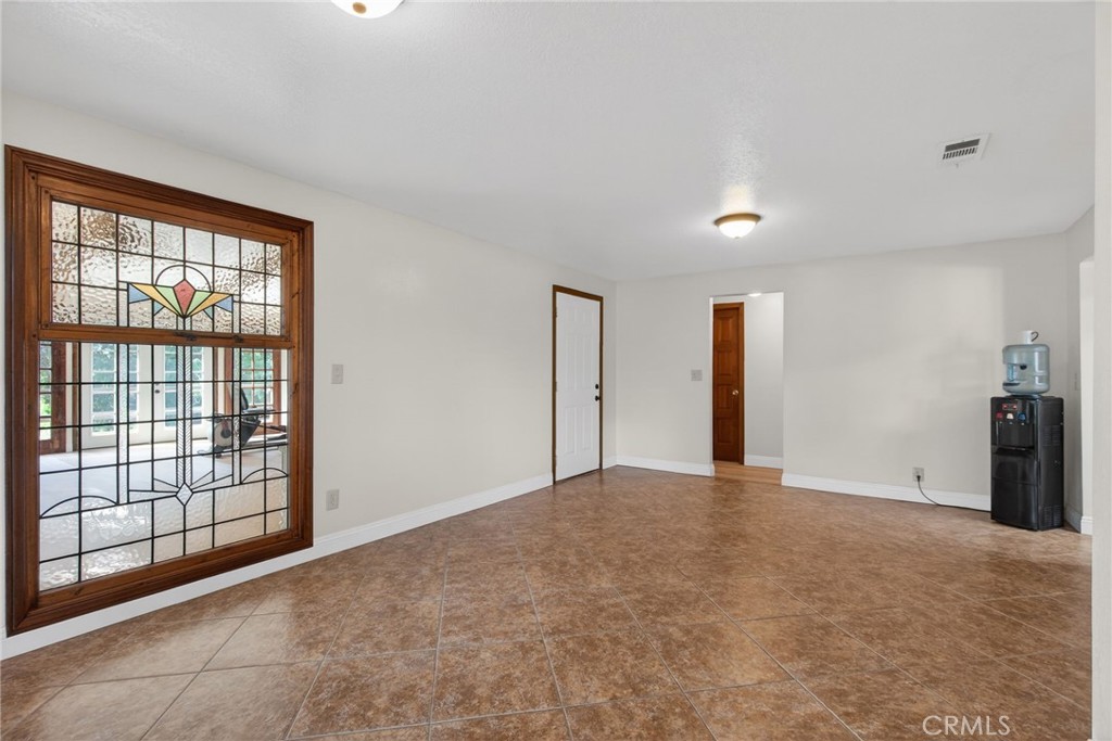 14435 Wood Road Riverside, CA 92508 - Photo 7 of 66 a view of an empty room with a window