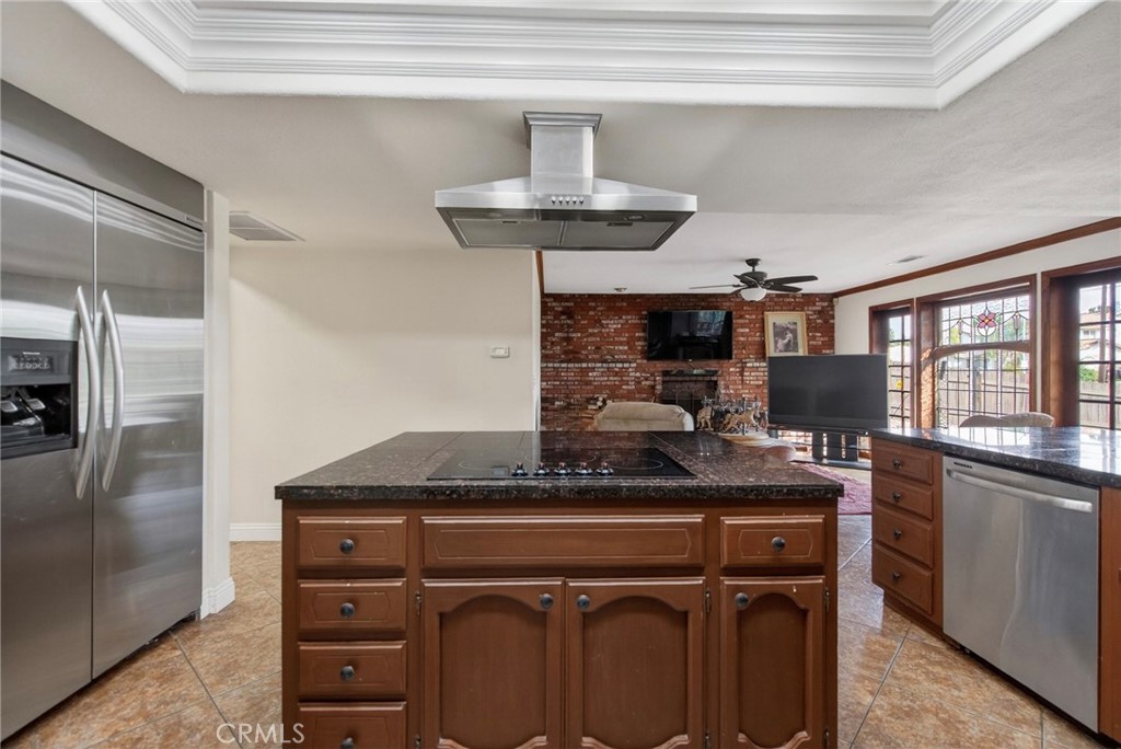 14435 Wood Road Riverside, CA 92508 - Photo 10 of 66 a kitchen with stainless steel appliances granite countertop a sink and cabinets