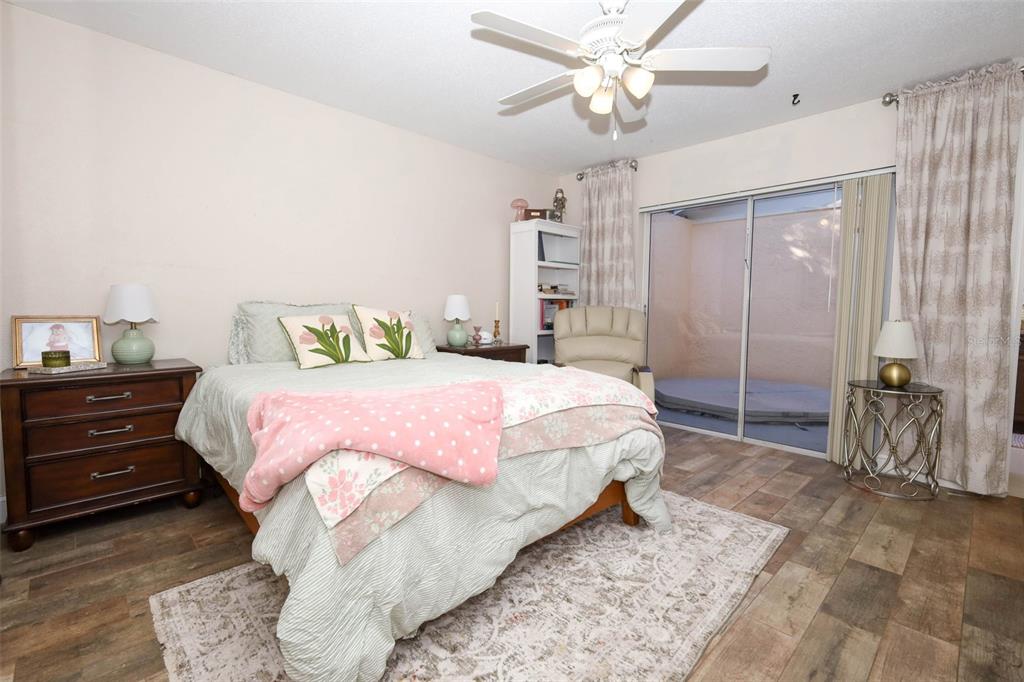 1531 Lawndale Circle Winter Park, FL 32792 - Photo 15 of 44 a bedroom with a bed and a chandelier