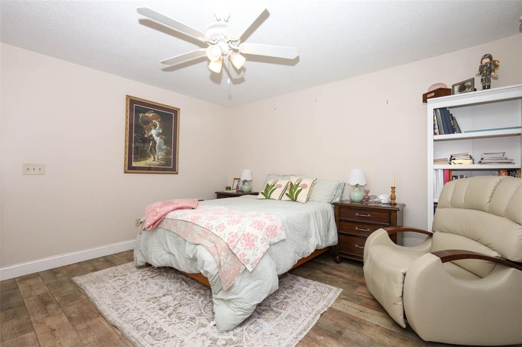 1531 Lawndale Circle Winter Park, FL 32792 - Photo 16 of 44 a bedroom with a bed and ceiling fan