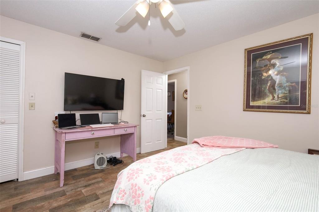 1531 Lawndale Circle Winter Park, FL 32792 - Photo 17 of 44 a bedroom with a bed and a flat screen tv