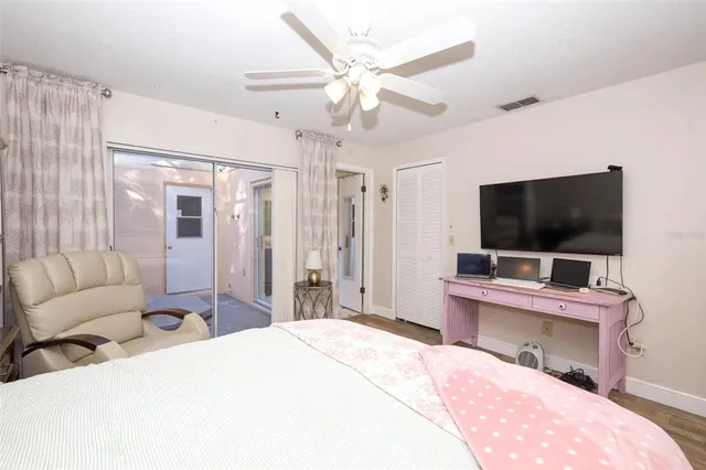 a room with a bed and a flat screen tv