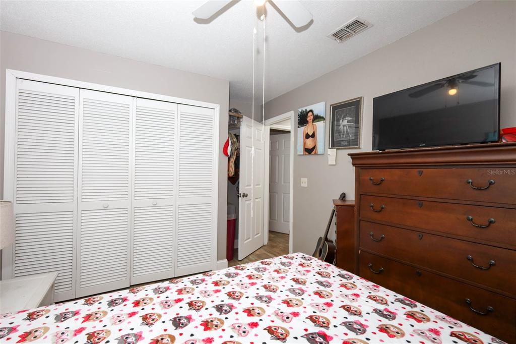 1531 Lawndale Circle Winter Park, FL 32792 - Photo 24 of 44 a bedroom with a bed and a flat screen tv