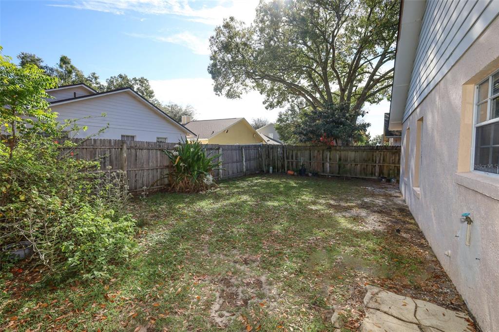 1531 Lawndale Circle Winter Park, FL 32792 - Photo 30 of 44 a view of a small yard in front of a house with large tree