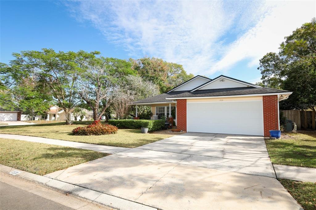 1531 Lawndale Circle Winter Park, FL 32792 - Photo 35 of 44 a view of a house with a yard and large trees