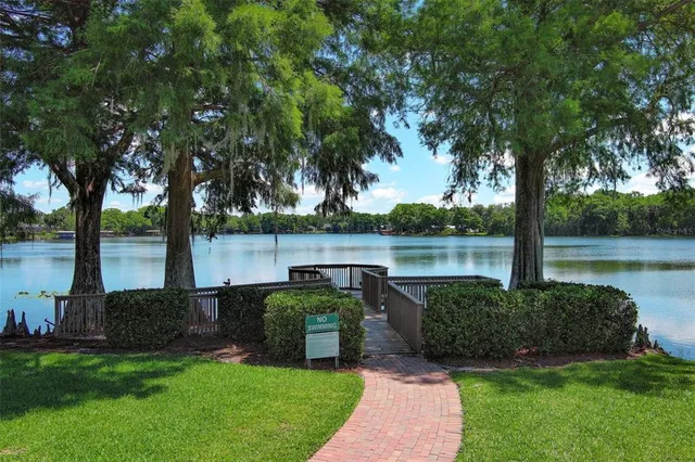 a view of a lake with a table and chairs