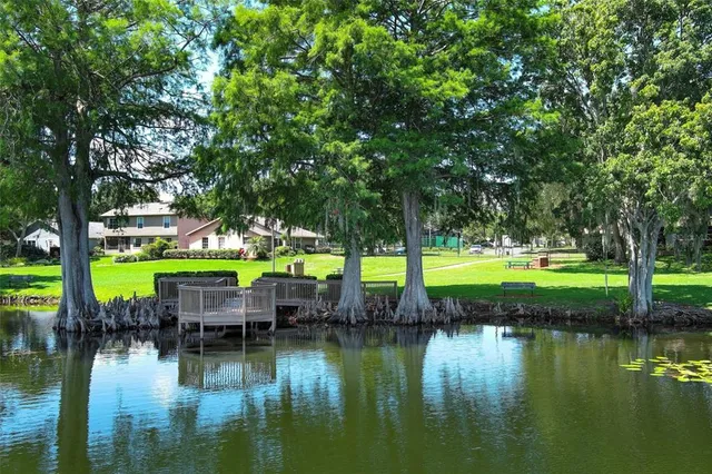 a view of a lake with trees by side of it
