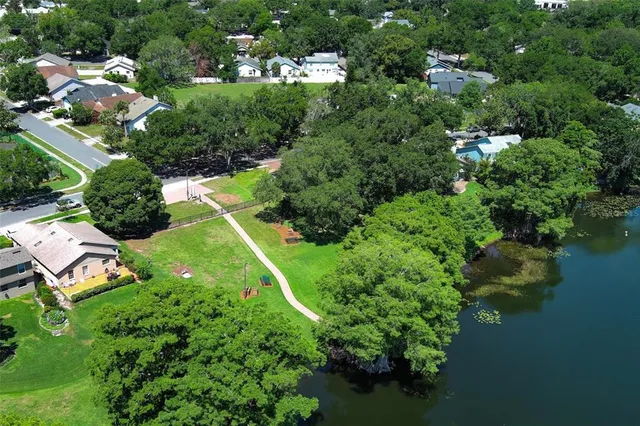 an aerial view of a house with garden space lake view and lake view