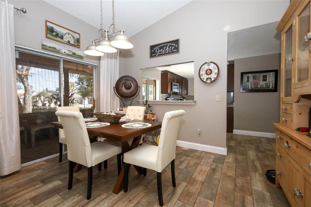 1531 Lawndale Circle Winter Park, FL 32792 - Photo 10 of 44 a view of a dining room with furniture window and wooden floor