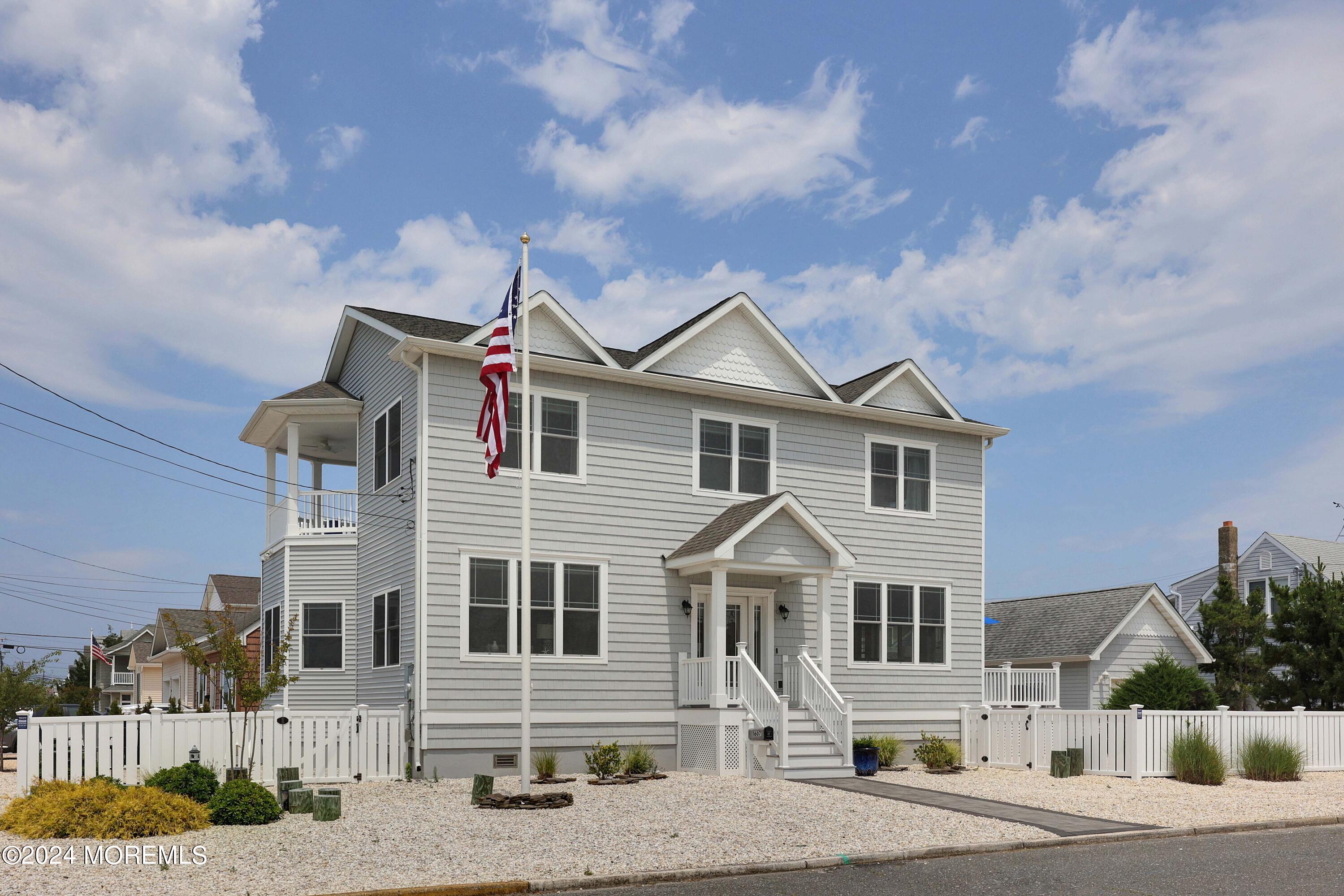 1607 Baltimore Avenue Lavallette, NJ 08735 - Photo 21 of 28 a front view of a house with a yard
