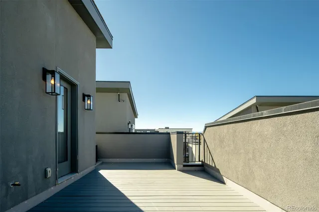 a view of a balcony with wooden floor and staircase