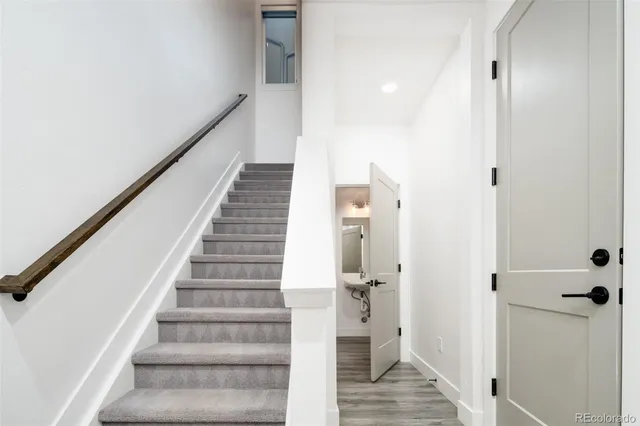 a view of entryway with wooden floor and staircase