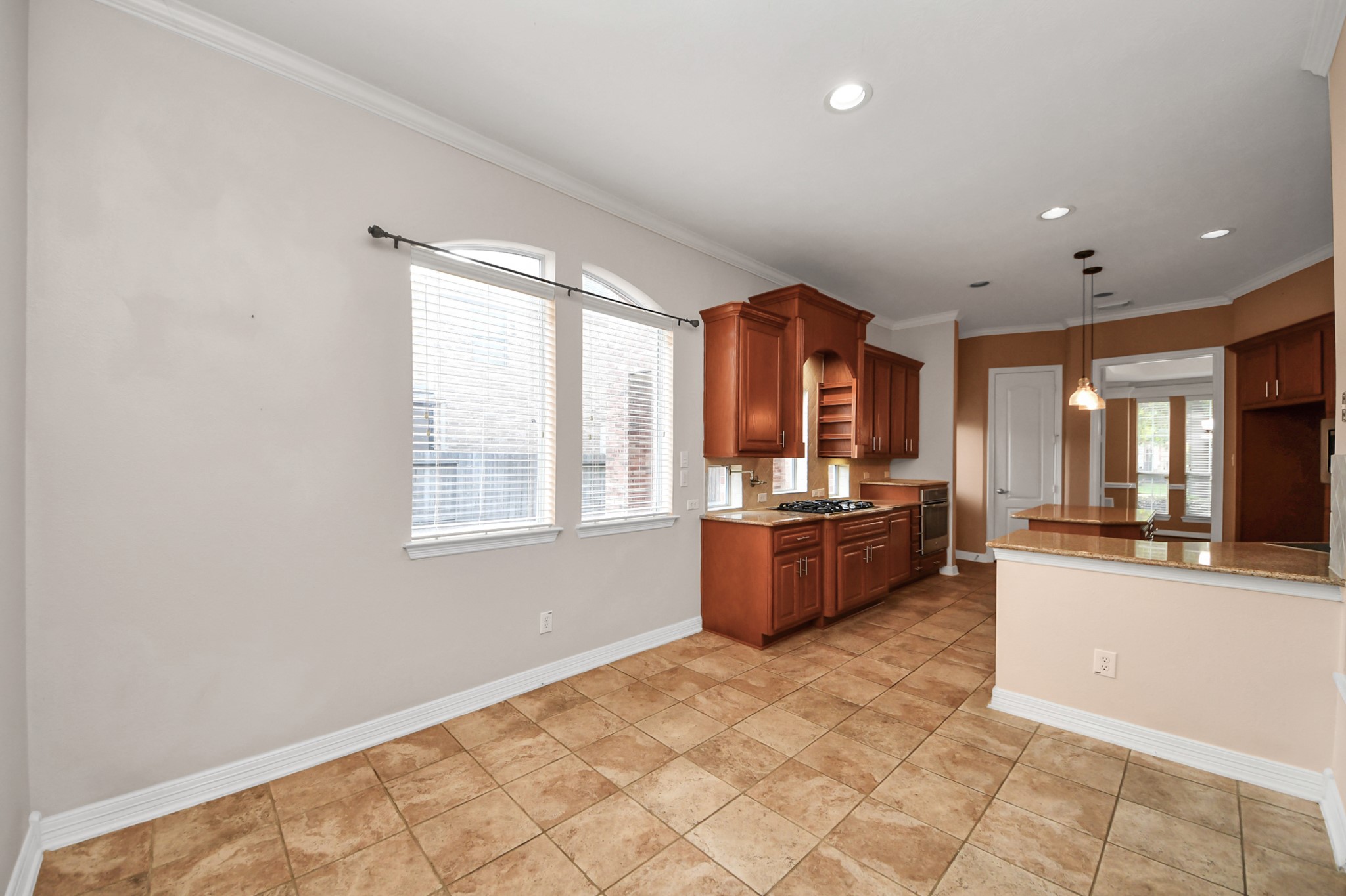 17618 Raven Canyon Lane Houston, TX 77095 - Photo 45 of 45 Another angle of the kitchen showcasing the open floor plan, perfect for hosting and entertaining, with views into the living room.