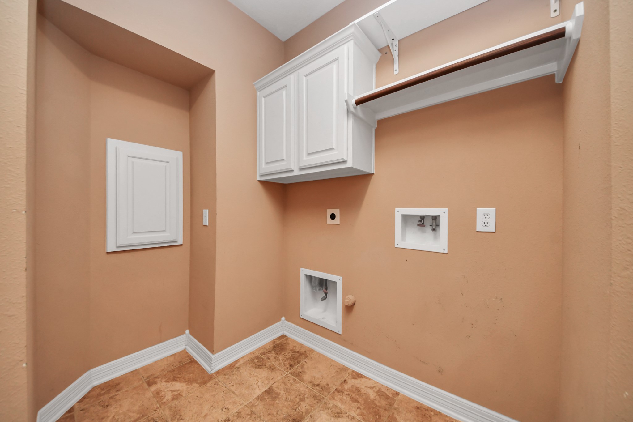17618 Raven Canyon Lane Houston, TX 77095 - Photo 16 of 45 Well-organized laundry area with shelving, cabinet storage, and the perfect space for a washer and dryer.