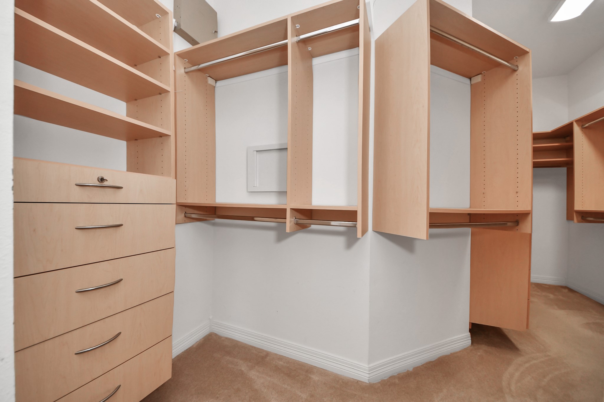 17618 Raven Canyon Lane Houston, TX 77095 - Photo 24 of 45 Spacious walk-in closet with organized shelving and drawers, offering ample storage and functionality.