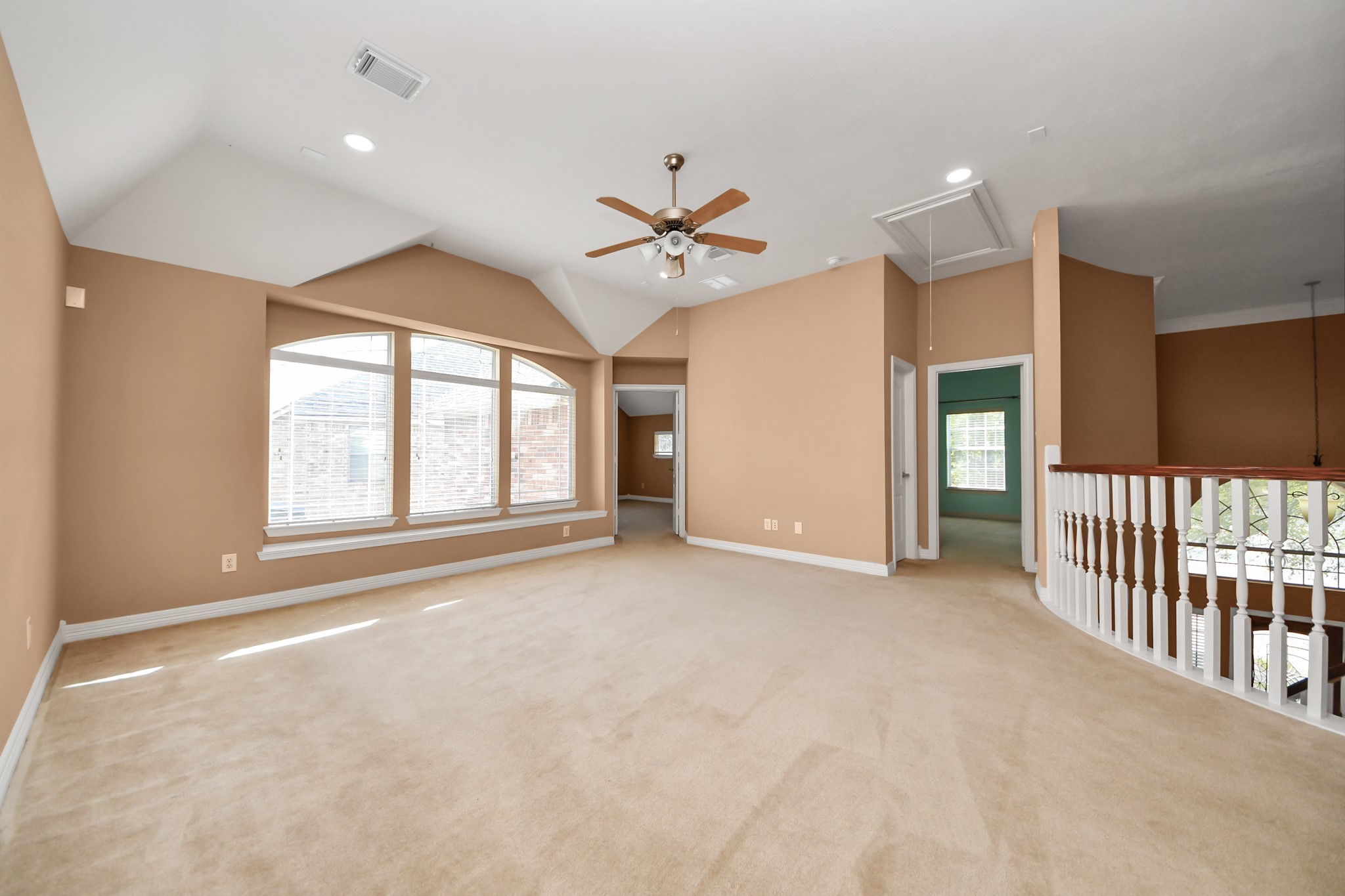17618 Raven Canyon Lane Houston, TX 77095 - Photo 26 of 45 Bright upstairs game room area with vaulted ceilings, large windows offering great views, and plenty of space for a home office or lounge area.