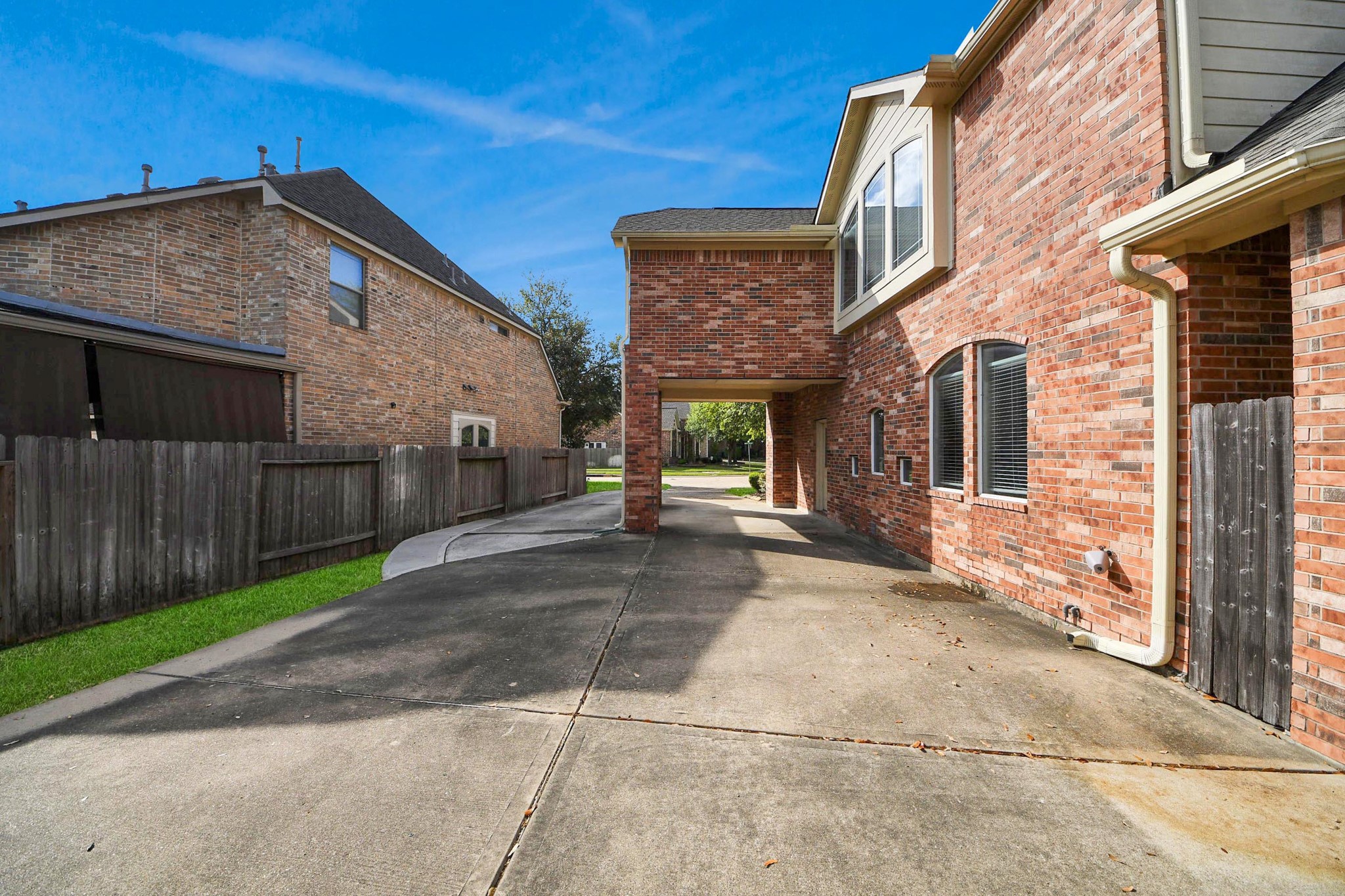 17618 Raven Canyon Lane Houston, TX 77095 - Photo 37 of 45 Well-maintained exterior of the home, with a convenient driveway leading to a spacious garage and a charming walkway leading to the front door.