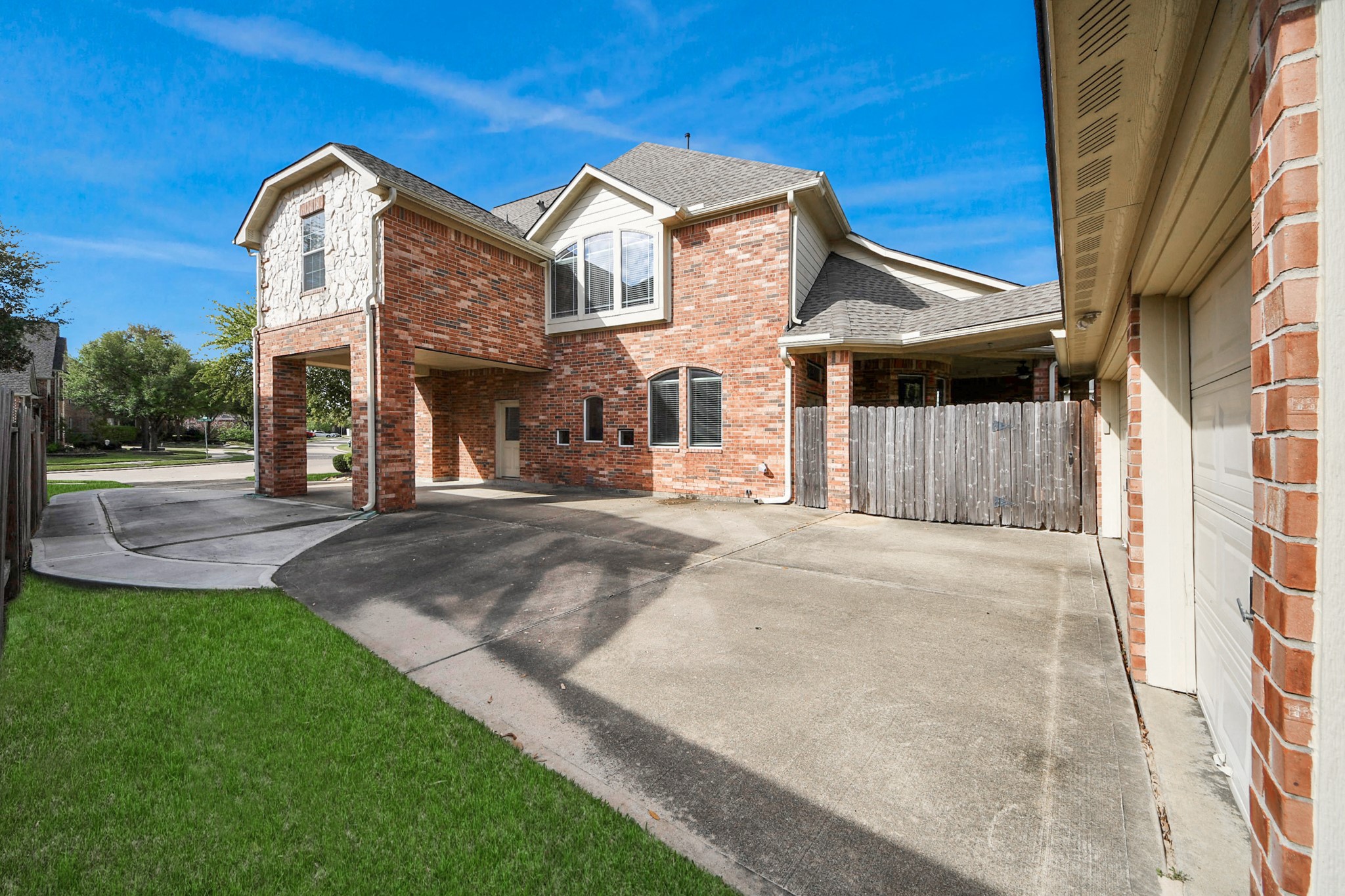 17618 Raven Canyon Lane Houston, TX 77095 - Photo 38 of 45 A view of the home's spacious driveway leading to a 3-car garage with ample parking space.