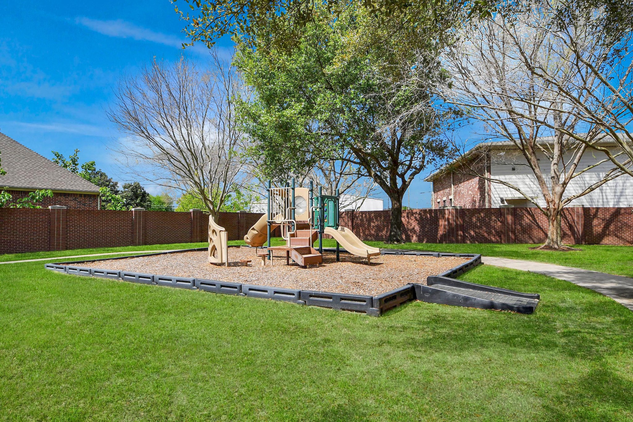 17618 Raven Canyon Lane Houston, TX 77095 - Photo 41 of 45 Community playground with slides and swings, providing a safe and fun place for children to play.