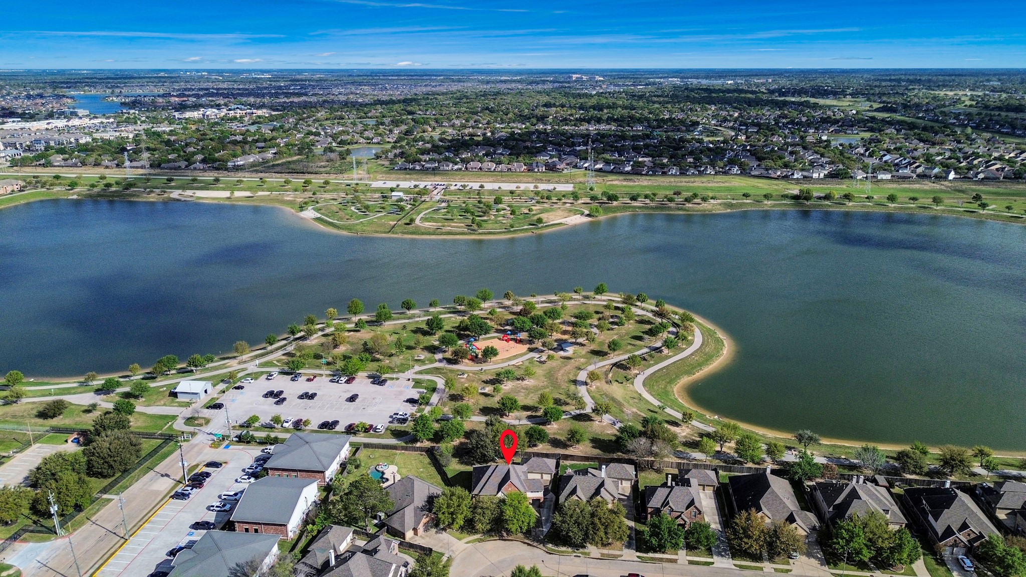 17618 Raven Canyon Lane Houston, TX 77095 - Photo 44 of 45 Aerial view showcasing the home's prime location, close to the scenic park and lake with recreational areas, offering a peaceful environment and easy access to outdoor activities.