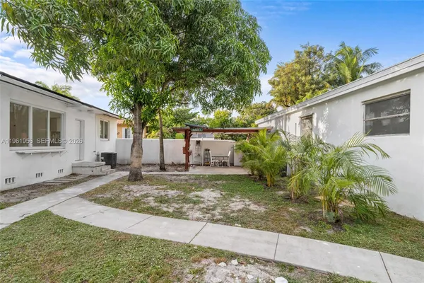 a kitchen with stainless steel appliances granite countertop wooden cabinets a stove top oven a sink and dishwasher