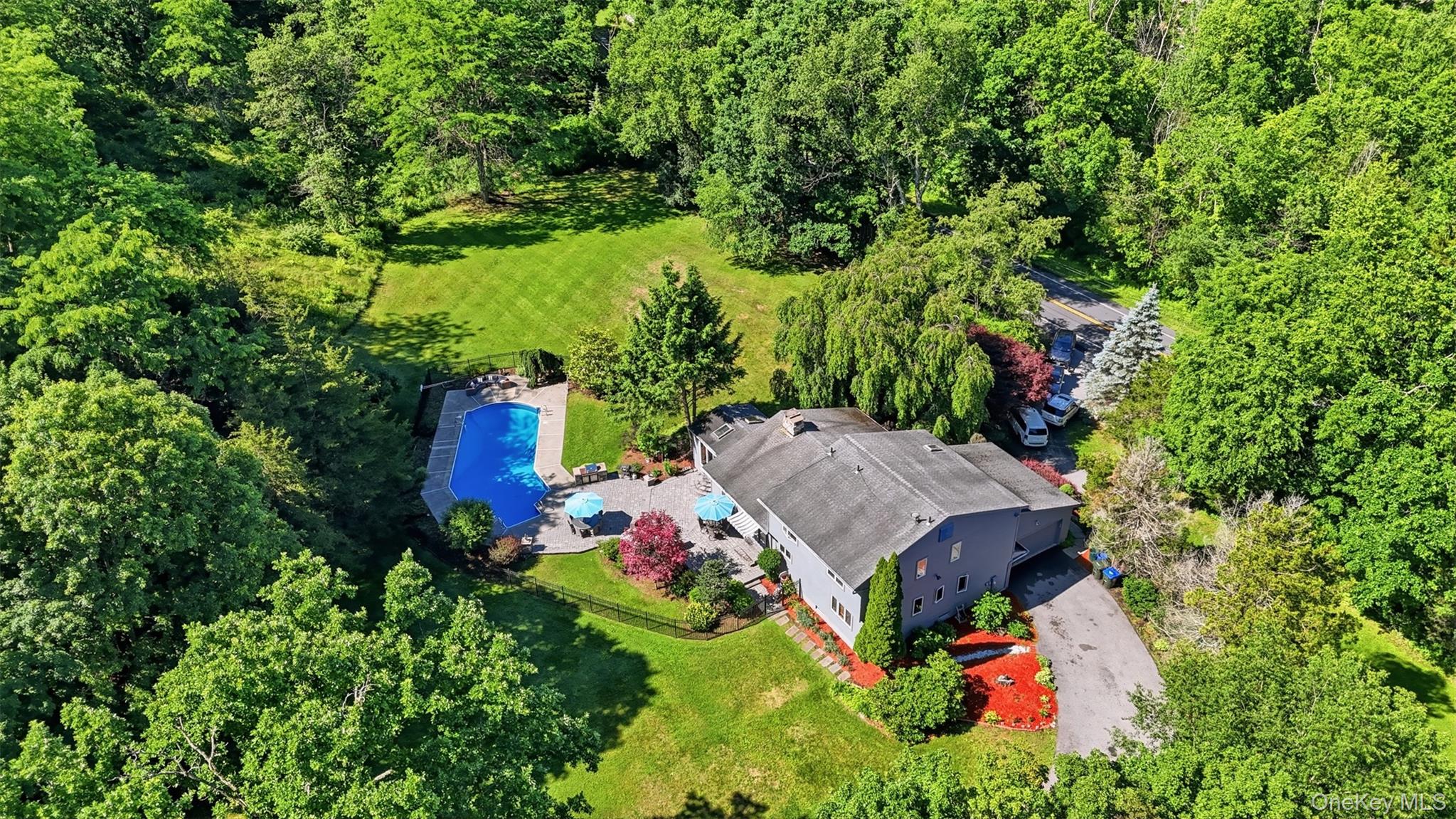 985 Craigville Road Chester, NY 10918 - Photo 34 of 36 Expansive property featuring a large residence, private swimming pool, paved driveway, mature trees, and landscaped grounds
