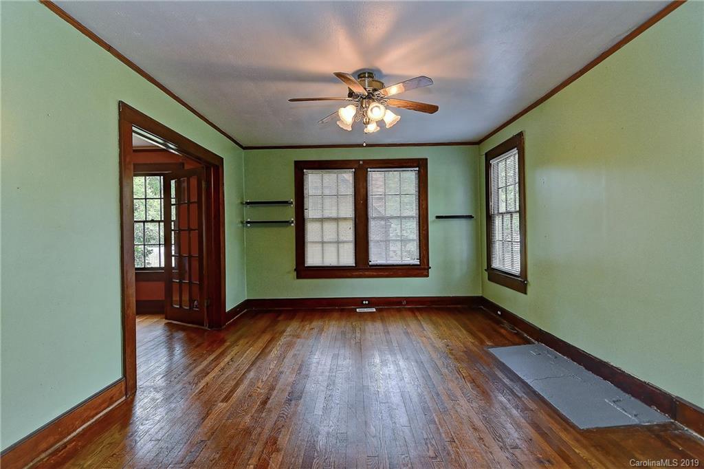 508 Ford Street Kannapolis, NC 28083 - Photo 4 of 13 wooden floor in an empty room with a window