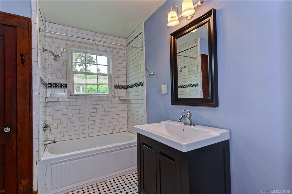 508 Ford Street Kannapolis, NC 28083 - Photo 6 of 13 a bathroom with a sink a toilet and shower