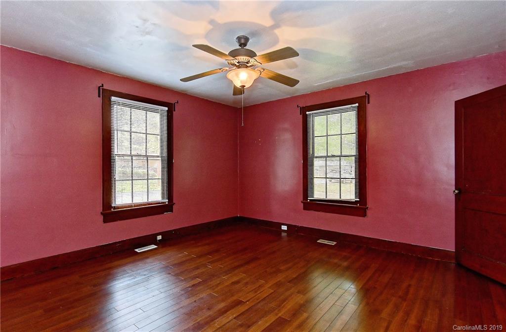 508 Ford Street Kannapolis, NC 28083 - Photo 8 of 13 a view of an empty room with wooden floor and a window