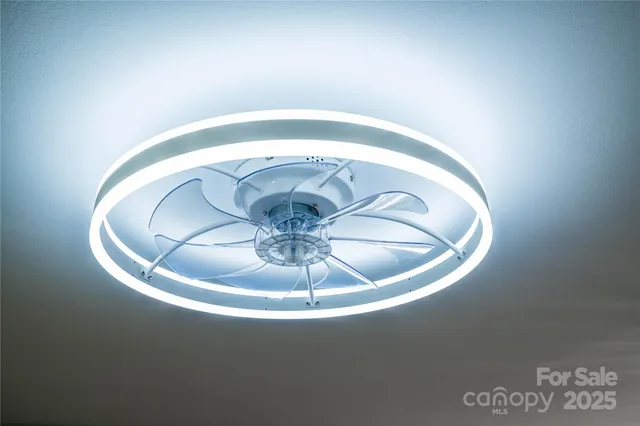 a view of a room with wooden floor and window