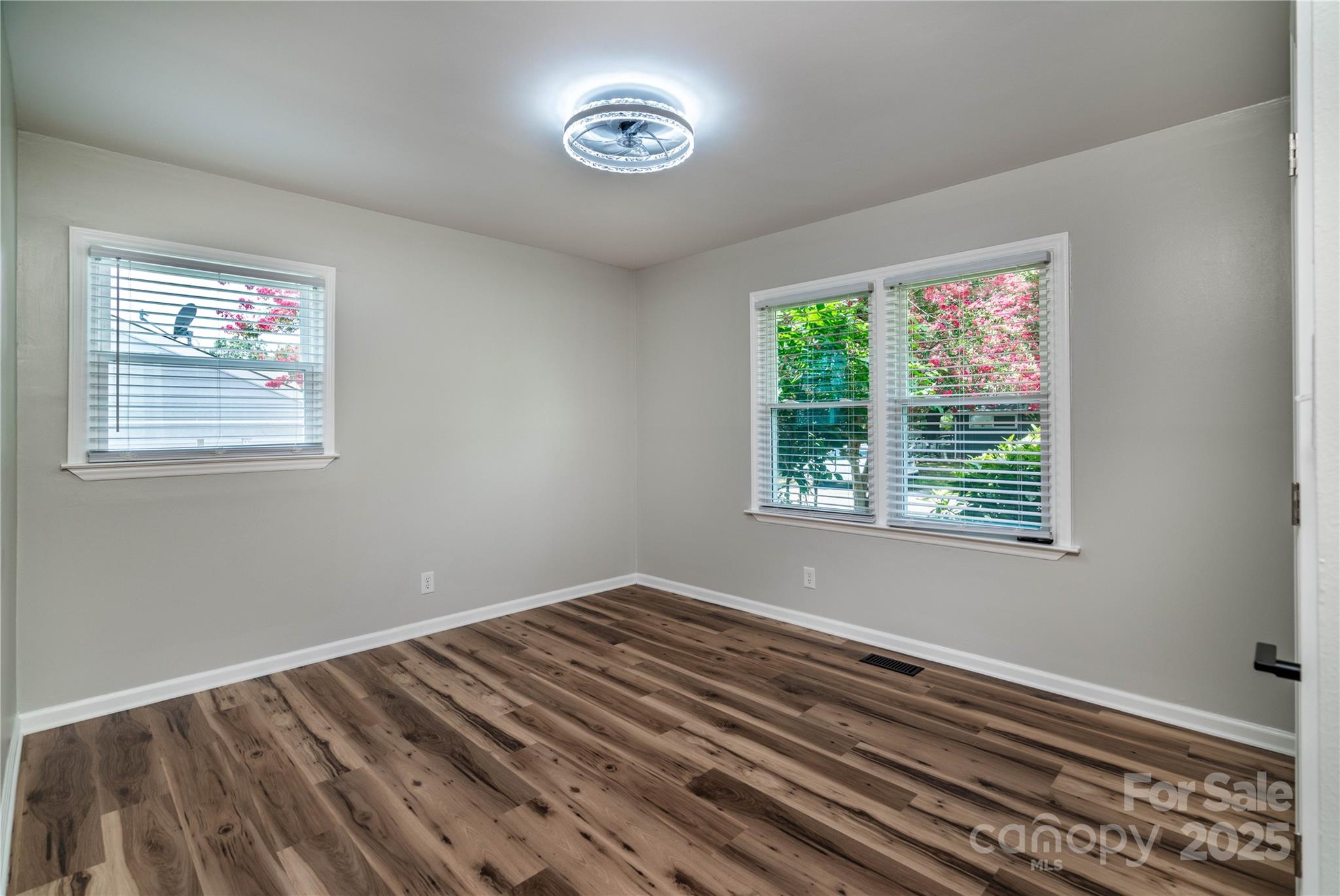 305 Linden Circle Gastonia, NC 28054 - Photo 17 of 37 a view of a room with wooden floor and windows